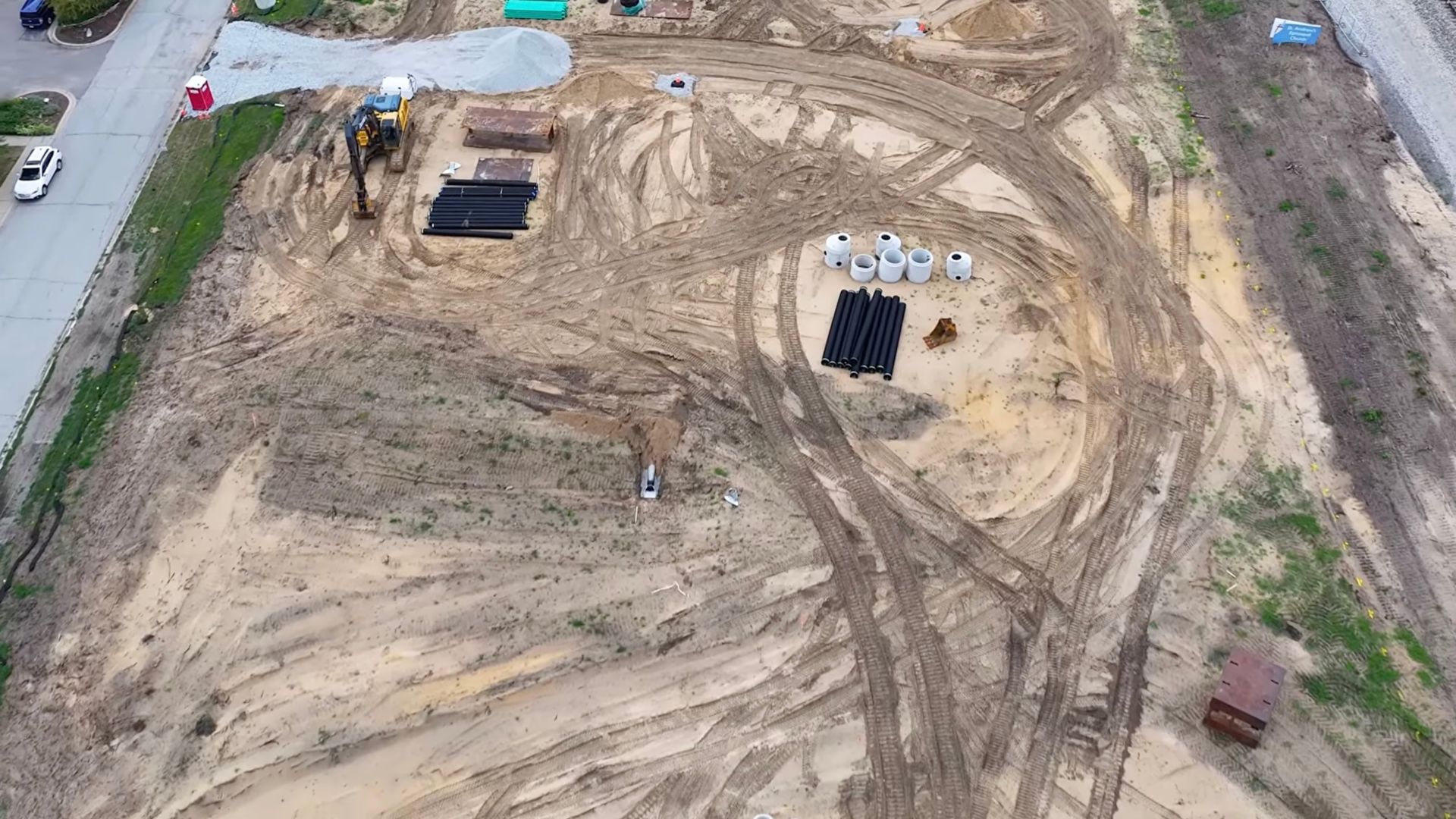 Drone shot of land leveled and prepped for new construction of The Moore townhomes to be built near Lake Michigan - Groundbreaking Update video thumbnail